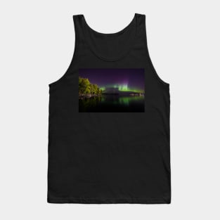 Northern lights glowing over lake in Finland Tank Top